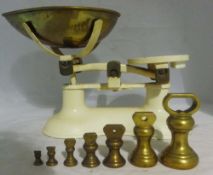 A set of "Boots" kitchen scales and weights
