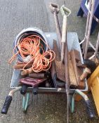A wheelbarrow and a quantity of tools