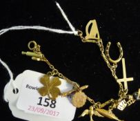A 9 ct gold charm bracelet and charms (10 grammes all in)