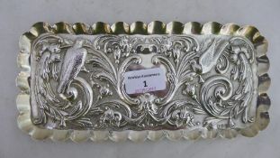 An embossed silver tray