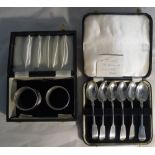 A cased set of six Victorian silver teaspoons and a pair of napkin rings