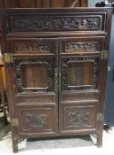 A 19th century Chinese carved cabinet