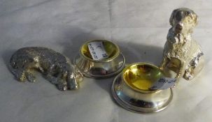 A pair of silver plated dog salts