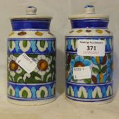 Two Iznik style lidded storage pots