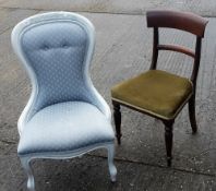 An upholstered nursing chair and a dining chair