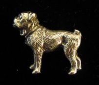 A small silver model of a dog