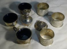 Silver condiments and white metal napkin rings