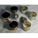 Silver condiments and white metal napkin rings