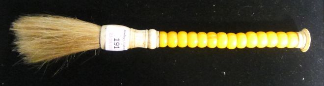 An amber and bone mounted brush