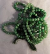 Two strings of jade beads