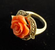 A silver and coral ring
