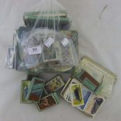 A collection of cigarette and tea cards