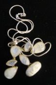 A moonstone set silver modernist pendant on silver chain