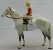A Beswick dapple grey racehorse with jockey up