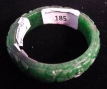 A carved jade bangle