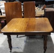 A Victorian mahogany dining table