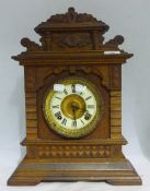 A Victorian walnut mantle clock
