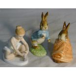 A Doulton ballerina and two Peter Rabbit figurines