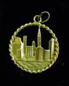A 9 ct gold pendant of the New York skyline,
