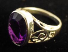 A silver and amethyst ring