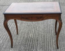 A 19th century marquetry inlaid centre table