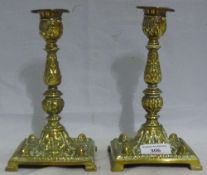 A pair of Victorian cast brass candlesticks