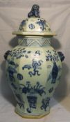 A blue and white octagonal vase and cover