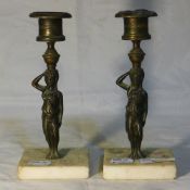 A pair of figural candlesticks