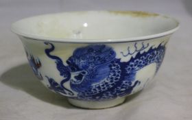 A Chinese blue and white bowl decorated with a dragon