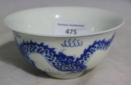 A Chinese blue and white bowl decorated with a dragon