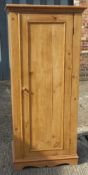 A Victorian pine single door wardrobe