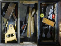 A quantity of vintage woodworking tools in a toolbox