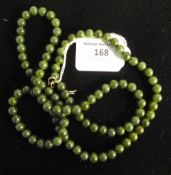 A green jade necklace with sterling clasp