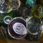 A collection of glass paperweights