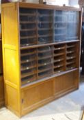 A large early 20th century haberdashery cabinet