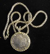 An American 1879 silver dollar mounted as a pendant on a silver chain