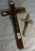 A mother-of-pearl mounted crucifix and another