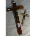 A mother-of-pearl mounted crucifix and another