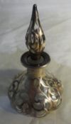 A silver overlay perfume bottle