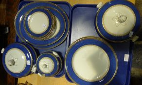 A blue and gilt decorated dinner service and a Doulton plate