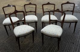 A set of six Victorian upholstered dining chairs