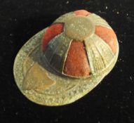 A jockey cap form pin cushion