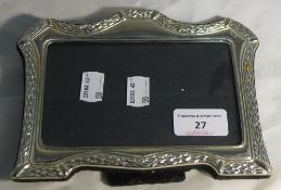 An unmarked silver photograph frame