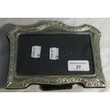 An unmarked silver photograph frame