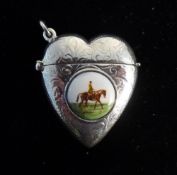 A silver heart shape vesta decorated with a horse