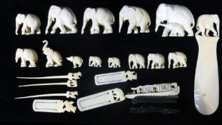A collection of late 19th/early 20th century carved ivory elephants etc