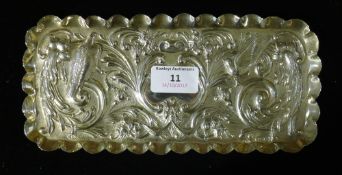 An embossed silver tray