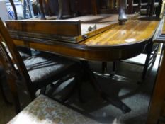 A 20th century two leaf twin pillar dining table