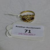 A contemporary 9 ct gold ring (4 grammes all in)