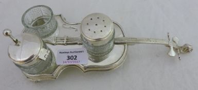 A silver plated violin cruet